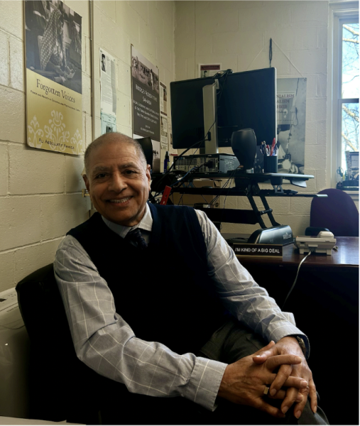 Dr. Ali Ahmida sitting in his office.