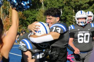 Number 13, AJ DeFilio, celebrates UNE's victory against Dean.