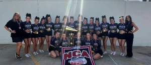 Photo pulled from: https://www.une.edu/news/2025/une-cheer-team-celebrates-historic-national-championship-win-daytona. 